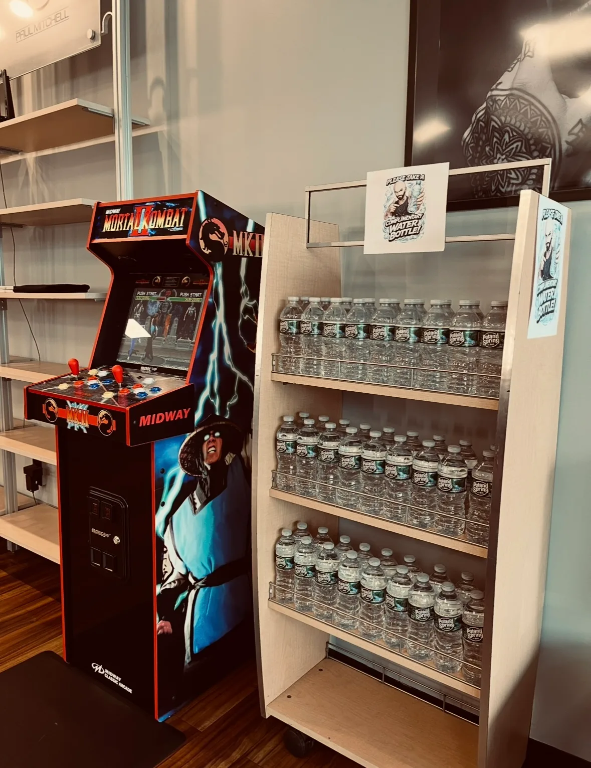 Mortal Kombat arcade cabinet beside the water bottle rack