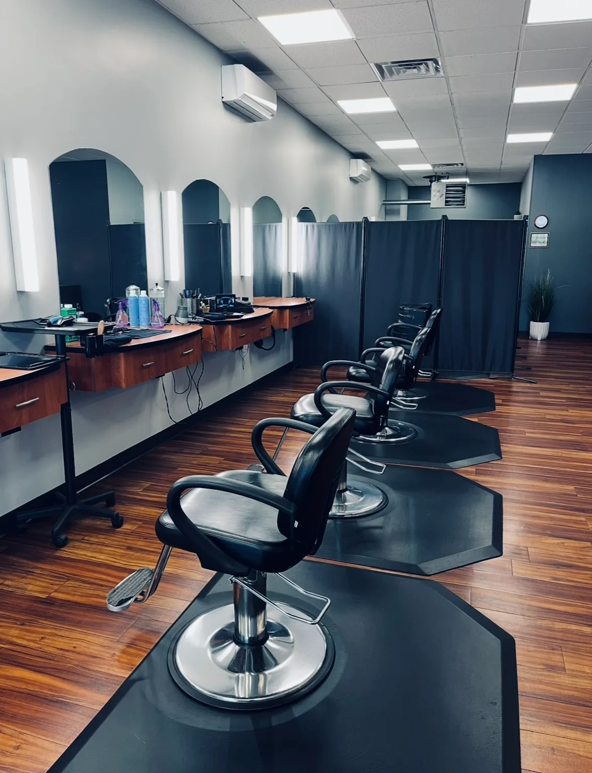 Row of barber chairs lined up at the styling stations