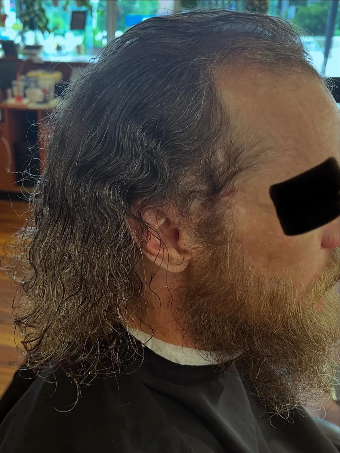 Before: long, grown-out hair and a heavy beard from the side