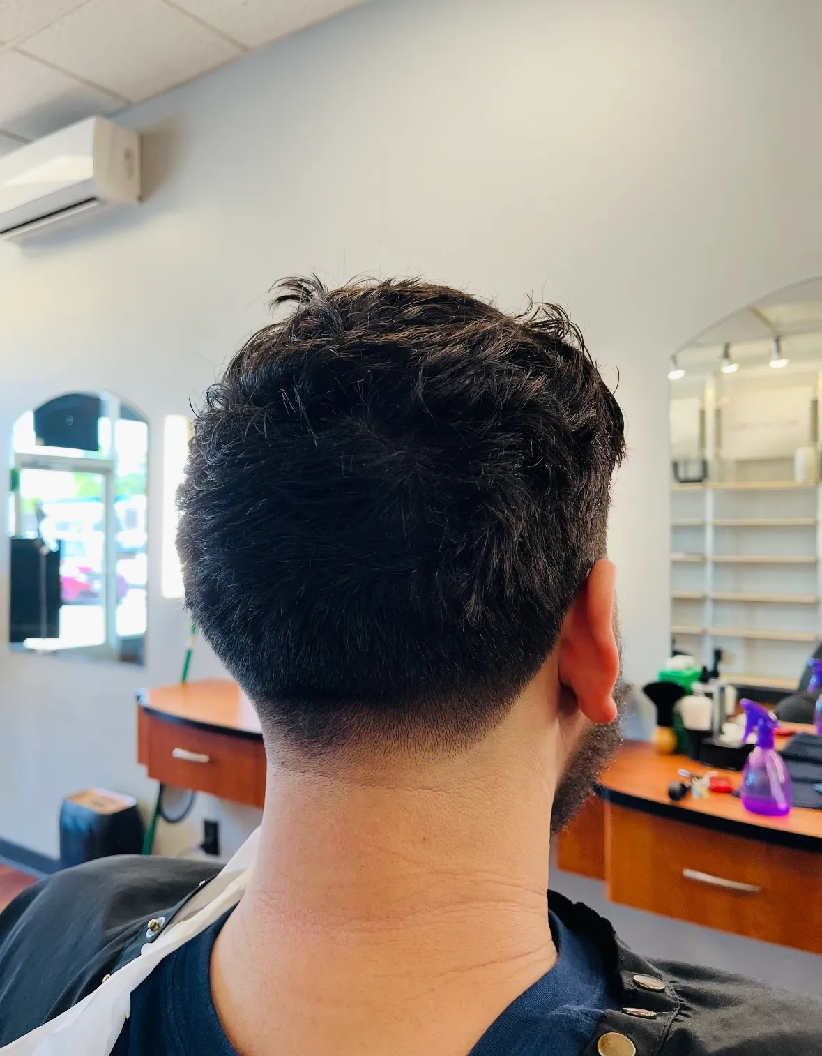 After: a clean men's taper fade with a sharp neckline